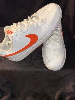Nike White Low-Top Sneakers with Orange Swoosh
